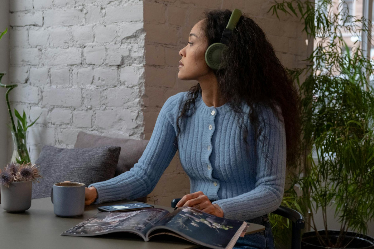 Professional listening to podcast with coffee